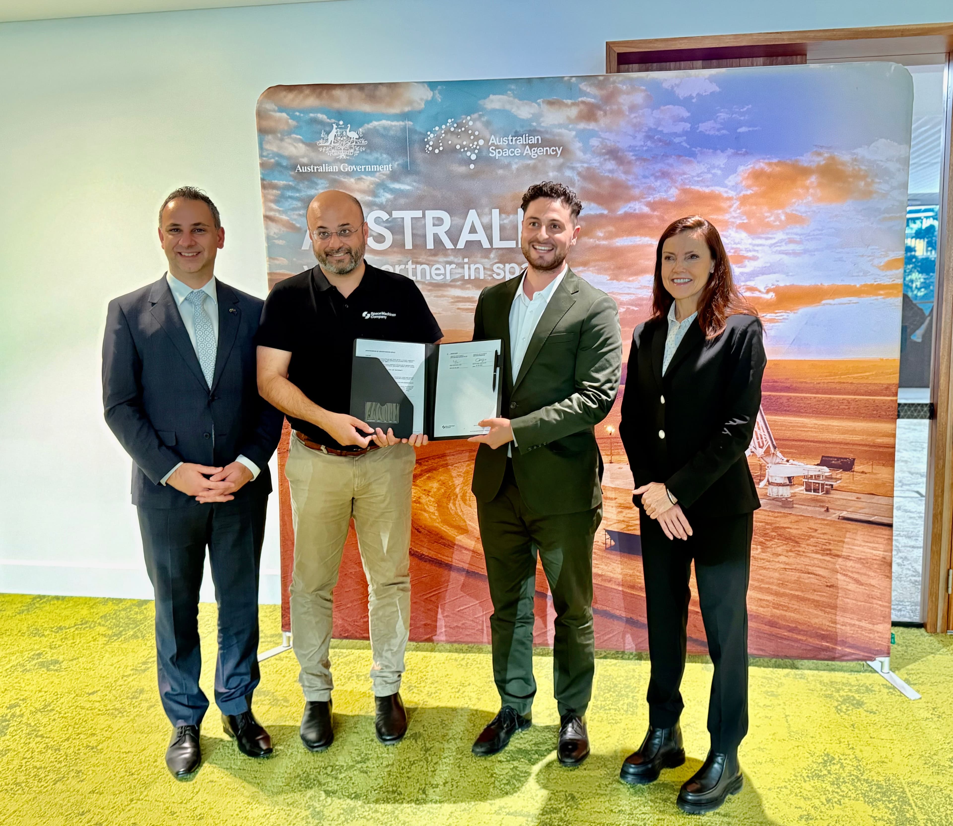 Space Machines Company and Reaction Dynamics representatives holding the signed MOU at the partnership announcement.